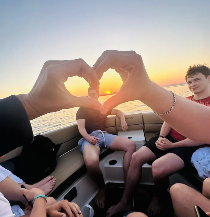 Heart hands at sunset