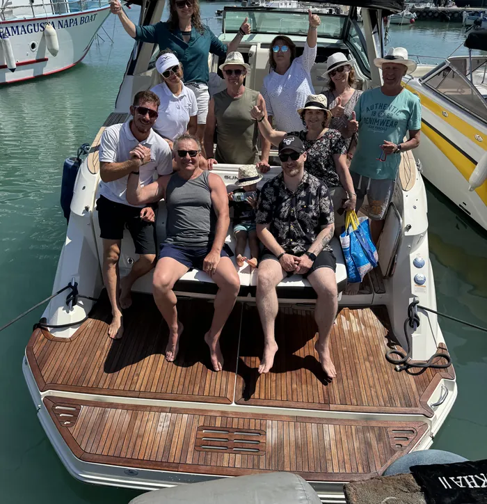 A group of friends on deck before setting sail