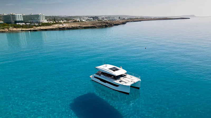 The MY4.S at anchor with the Ayia Napa shore behind